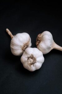 free photo of three raw garlics